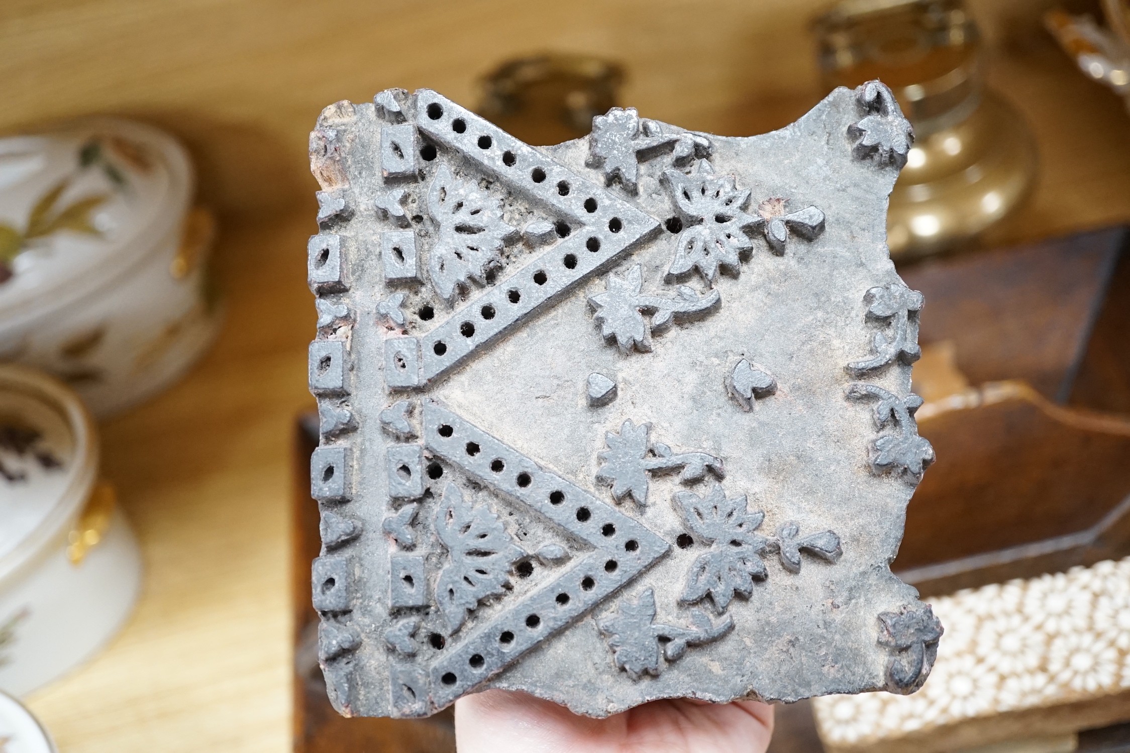 A wooden cutlery box, 42cm wide, together with carved patterned printing blocks, and other miscellaneous items